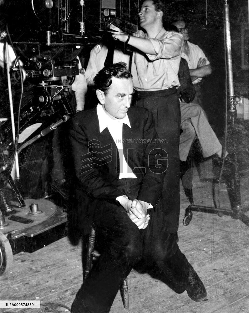 Director DAVID LEAN looks very serious on the set of HOBSON'