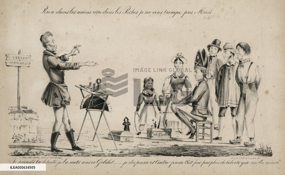 Magician performing the cup and balls trick to a small crowd