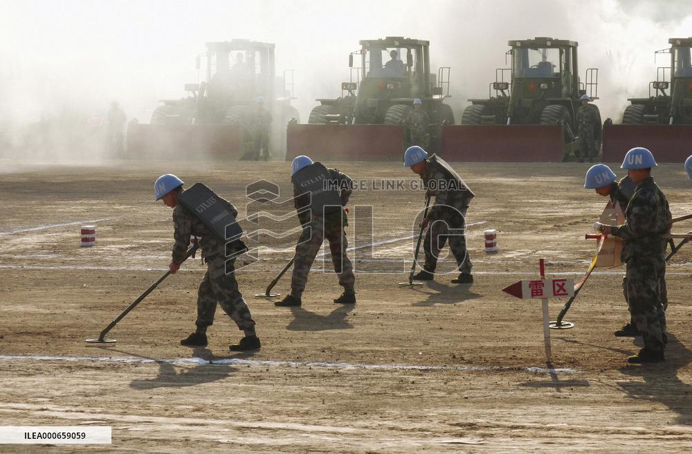 China offers press viewing of land mine clearing drill