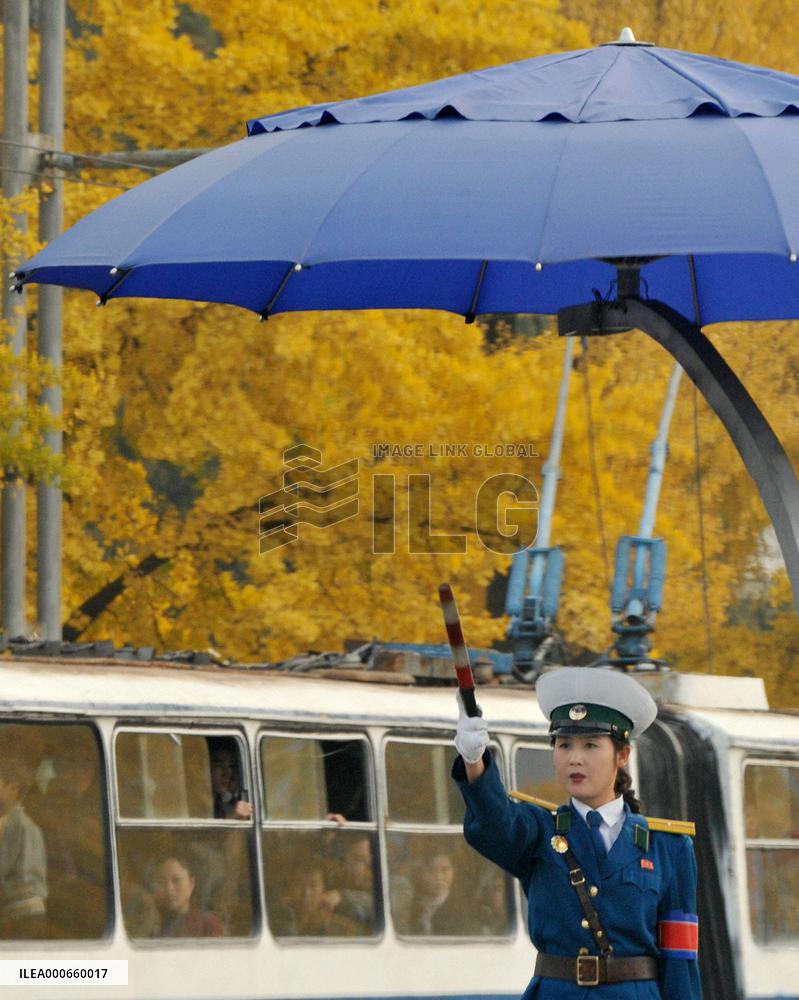 Policewoman controls traffic in Pyongyang