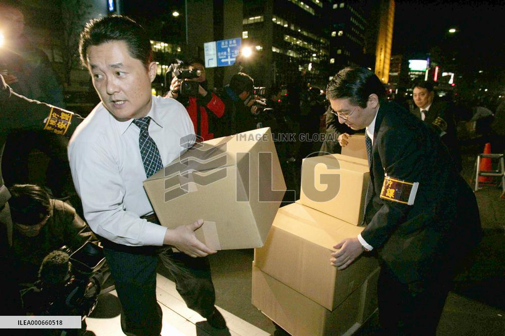 Investigators search Huser Ltd. over building scandal