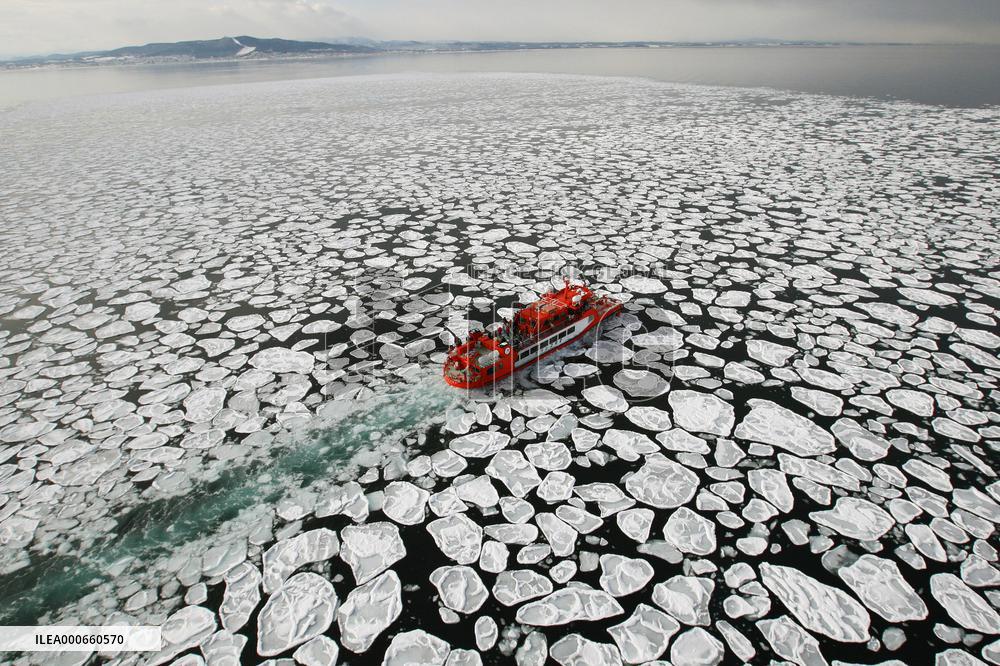 Tourists watch drift ice off Hokkaido