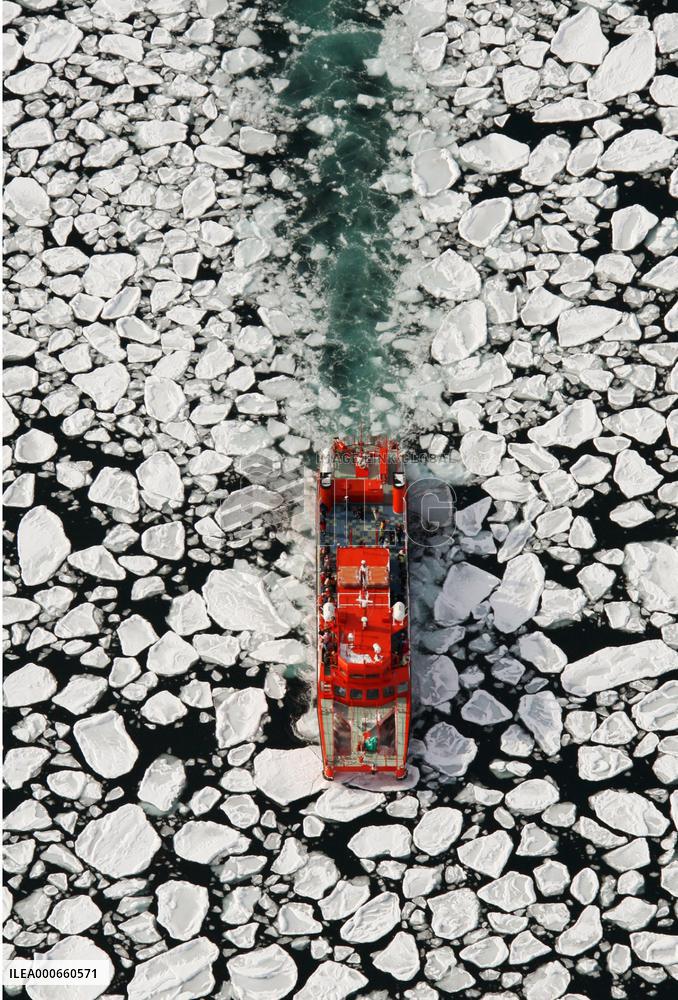 Tourists watch drift ice off Hokkaido