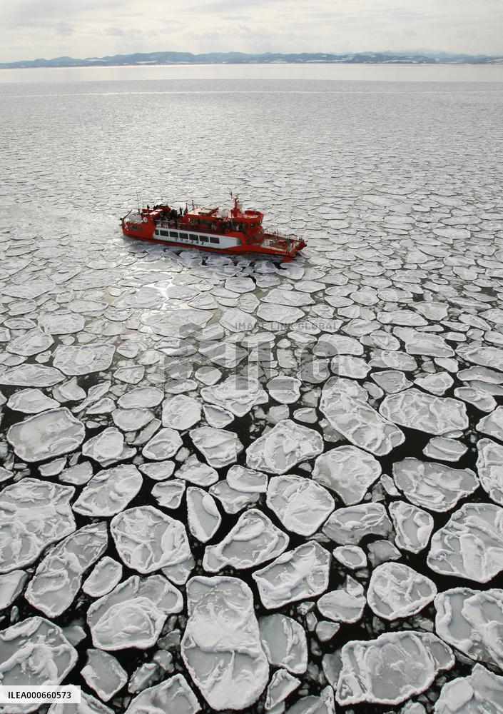 Tourists watch drift ice off Hokkaido