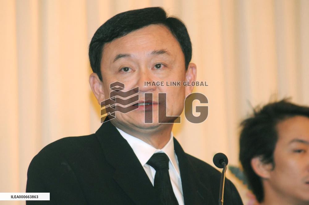 Ousted premier Thaksin returns home to face corruption charges