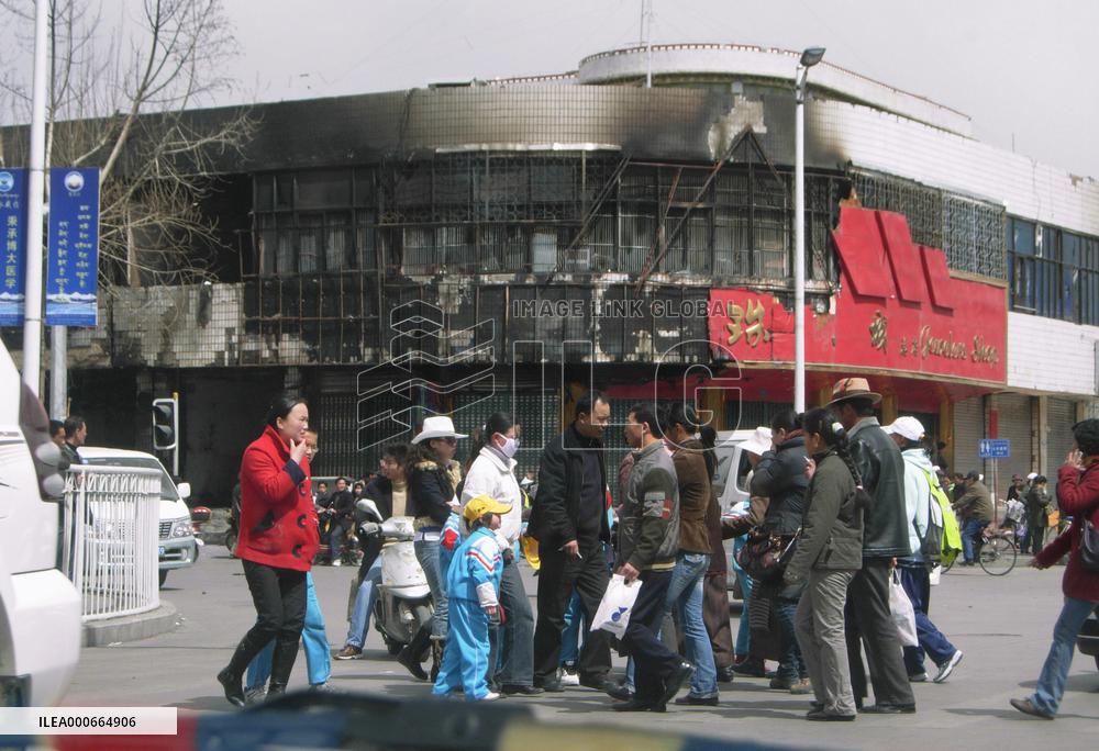 Tibet's capital quiet after riots, armed forces remain in sight