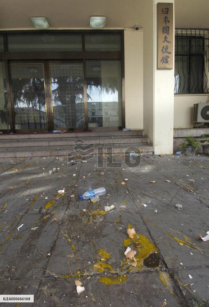 Stones, bottles strewn in Japan Embassy compound in Beijing
