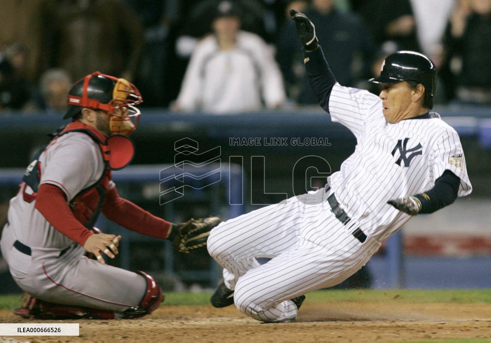 Yankees' Matsui slides home in 5th inning of game vs. Red Sox