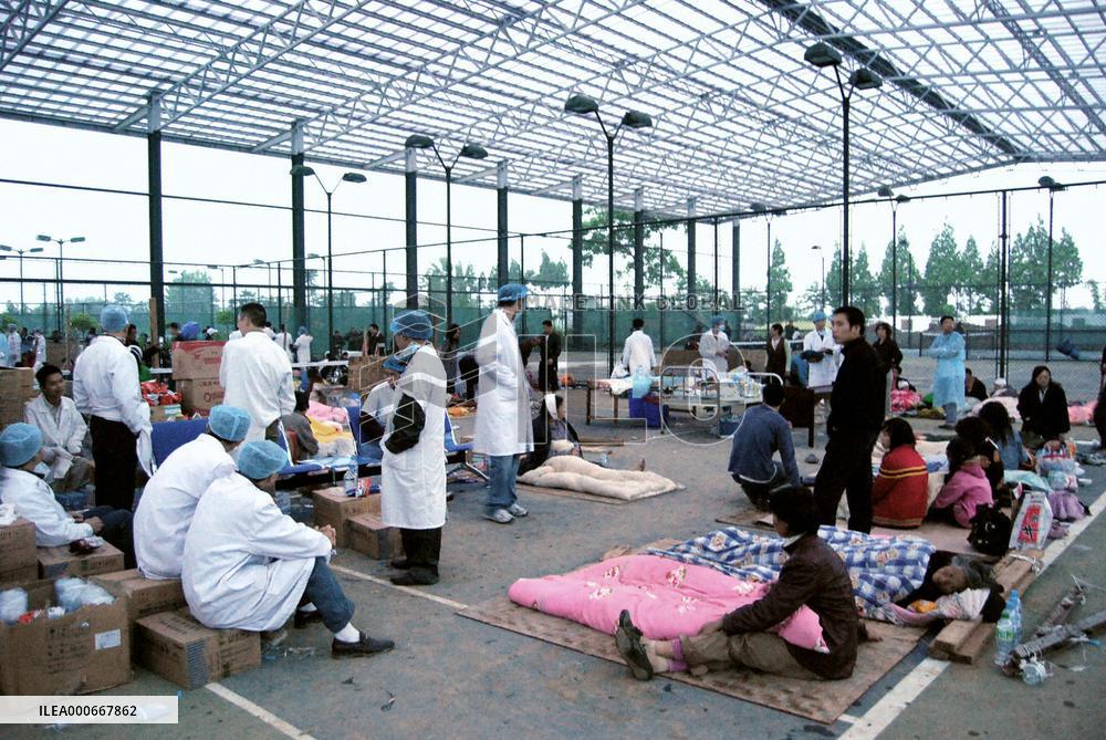 China earthquake -- Wounded people at tennis court