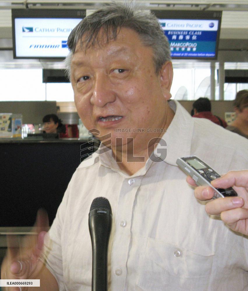 Tibet envoys leave H.K. after meeting Beijing officials