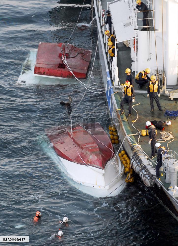 Fishing boat cut in two, capsizes after collision with freighter
