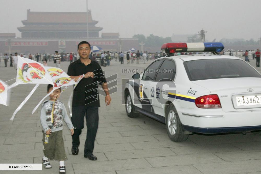Police keep watch at Tiananmen Square on 17th anniversary