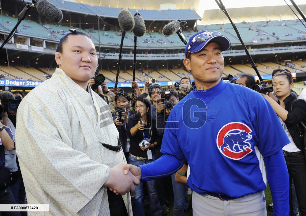 Sumo grand champion Hakuho throws ceremonial 1st pitch