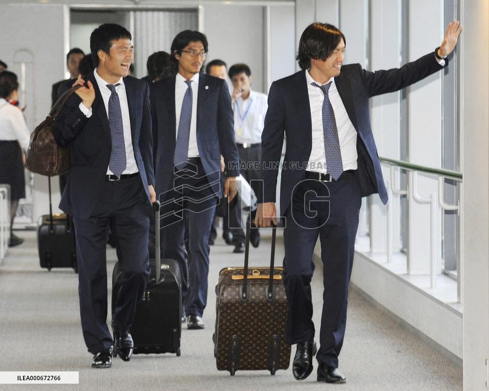 Japan's World Cup squad return home from South Africa
