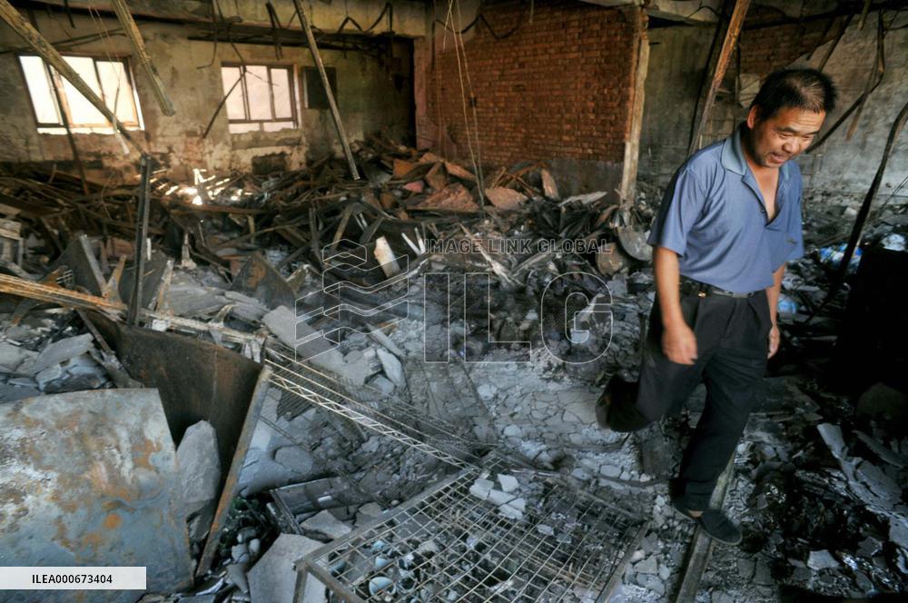 (CORRECTED) Store burned down in riot in China's Urumqi