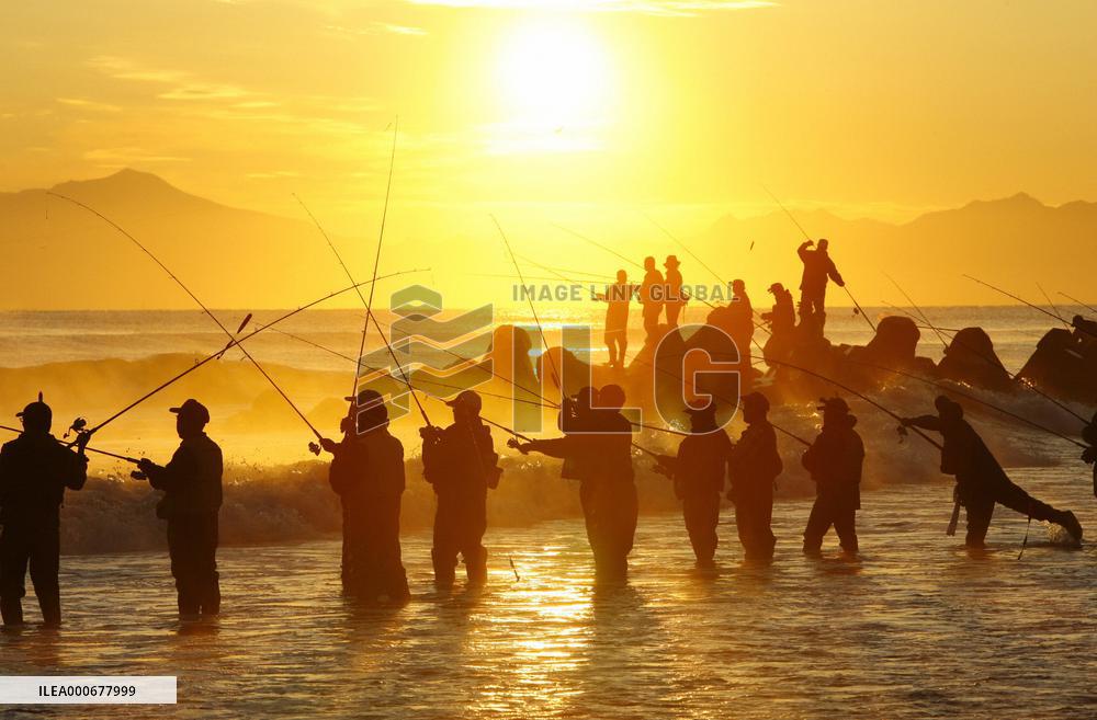 Anglers gather at Mokoto River in Hokkaido to catch salmon