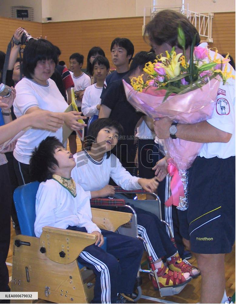 Ecuadorian soccer players visit school for disabled children