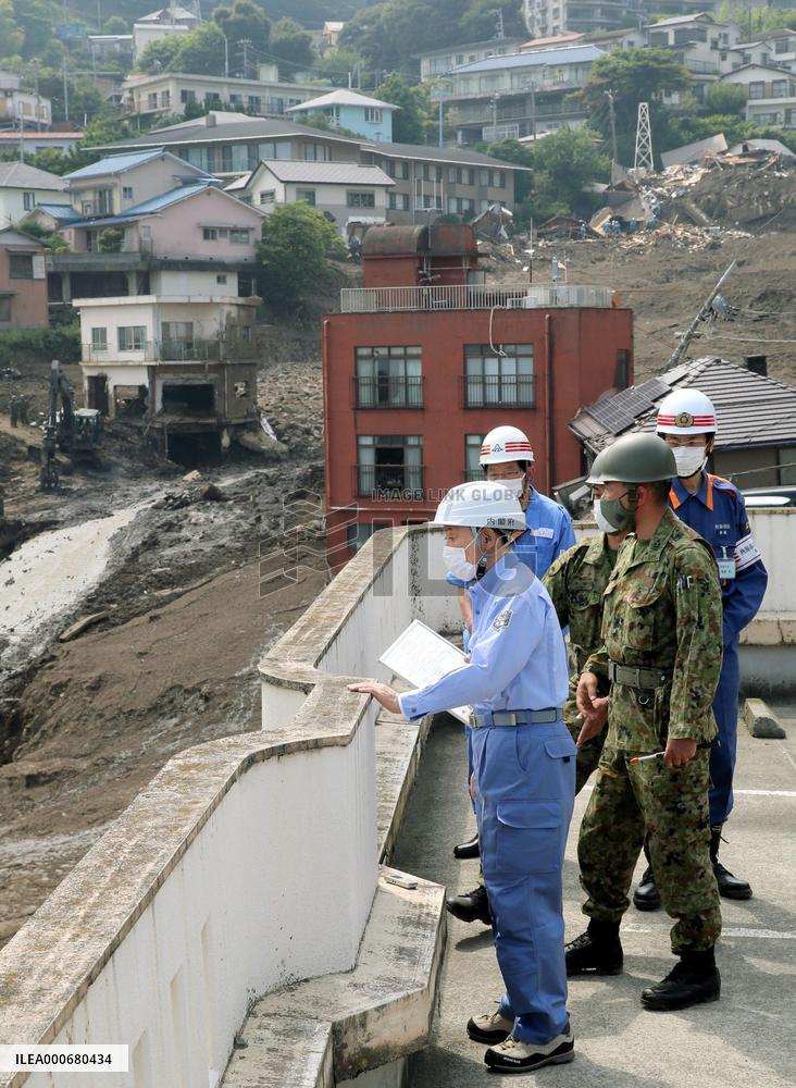 Japan PM Suga visits mudslide-hit Atami