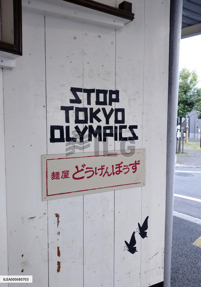 Anti-Olympic message on restaurant wall in Tokyo