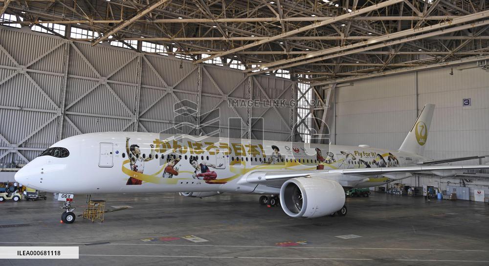JAL unveils Olympics-themed jet
