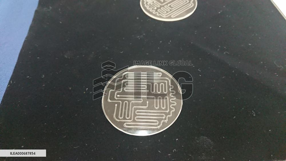 micro chemical chip made with mass production technology jointly developed by Panasonic and Micro Chemical Giken.