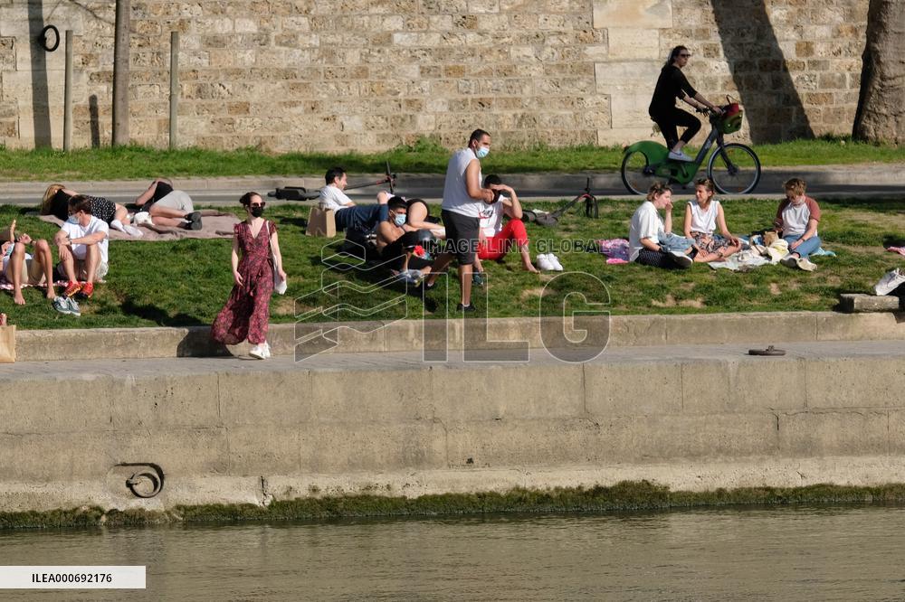 People Enjoying the Warm Weather Paris