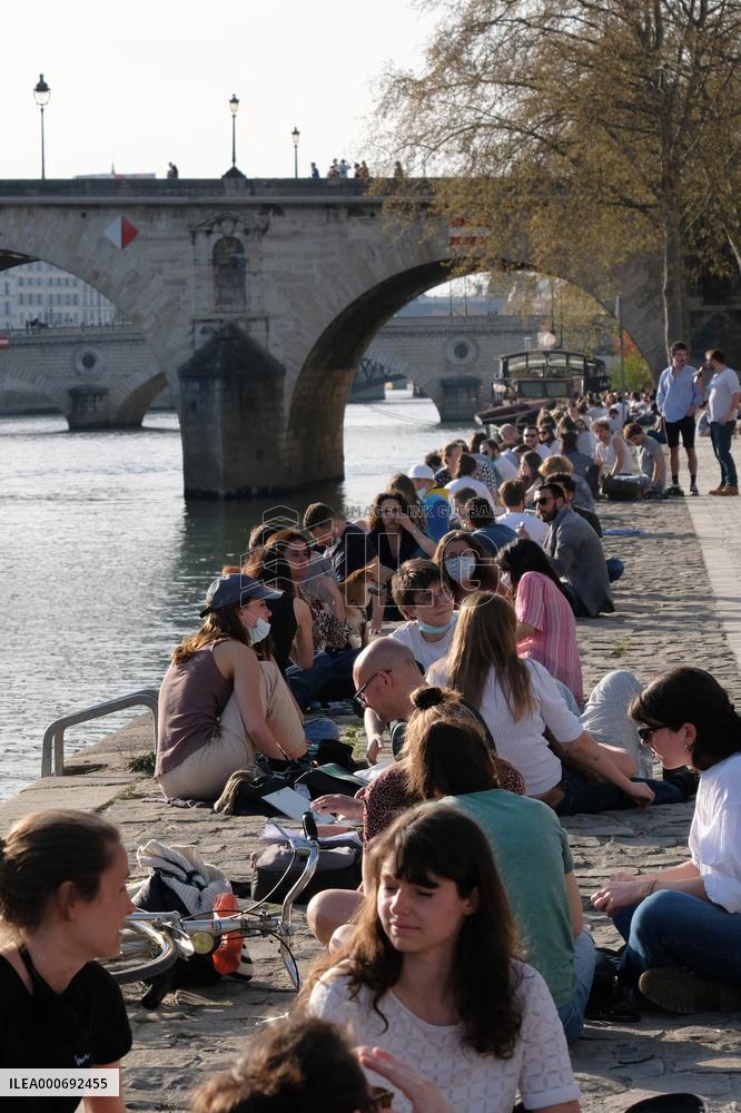 People Enjoying the Warm Weather Paris