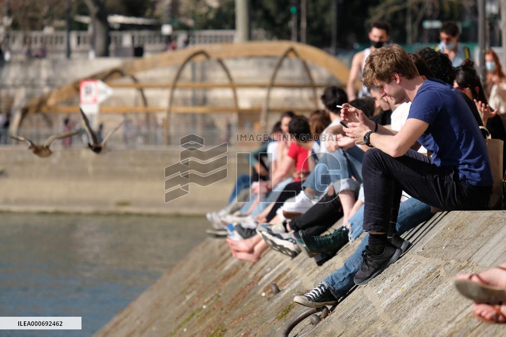 People Enjoying the Warm Weather Paris