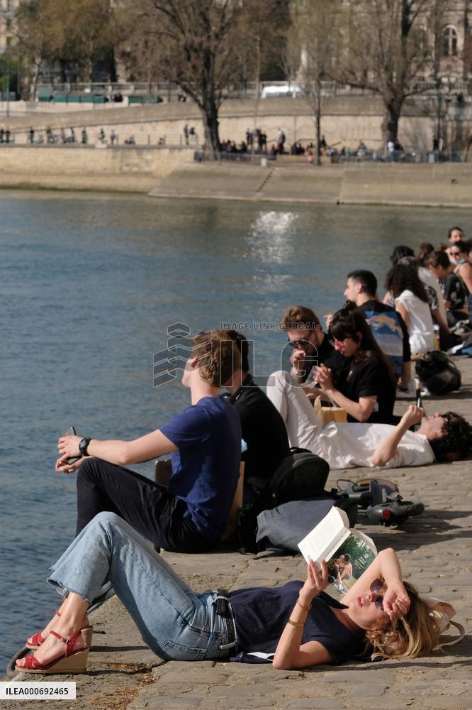 People Enjoying the Warm Weather Paris