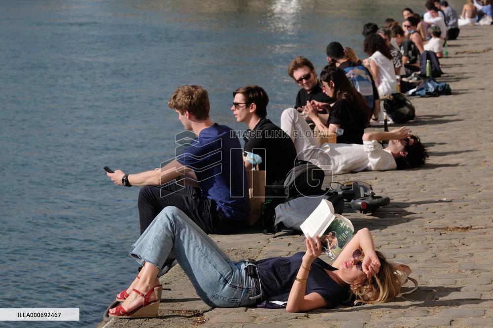 People Enjoying the Warm Weather Paris