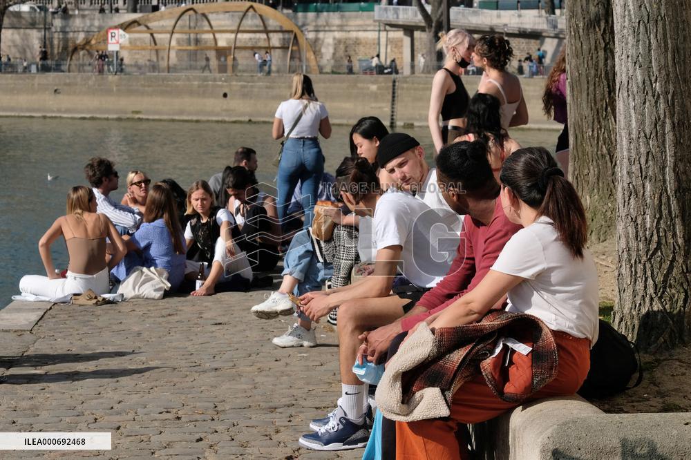 People Enjoying the Warm Weather Paris