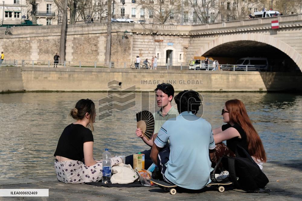 People Enjoying the Warm Weather Paris