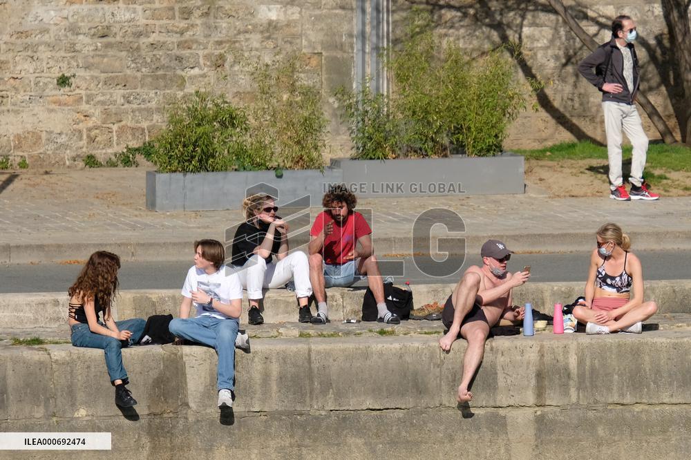 People Enjoying the Warm Weather Paris