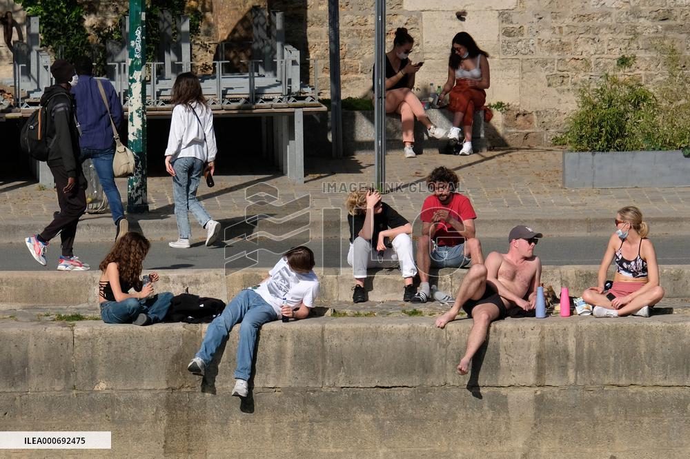 People Enjoying the Warm Weather Paris
