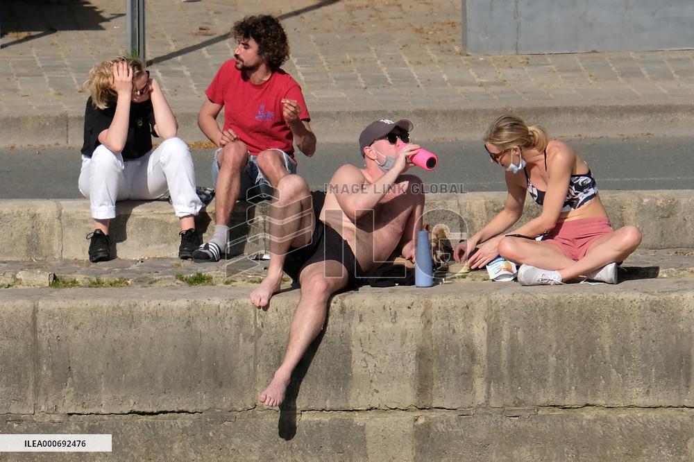 People Enjoying the Warm Weather Paris