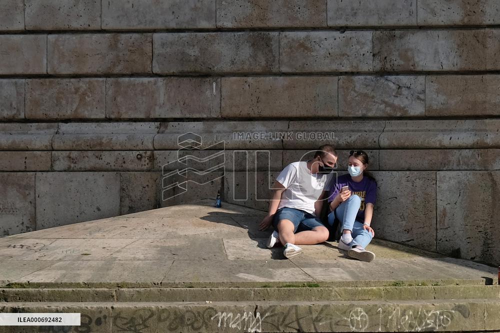 People Enjoying the Warm Weather Paris