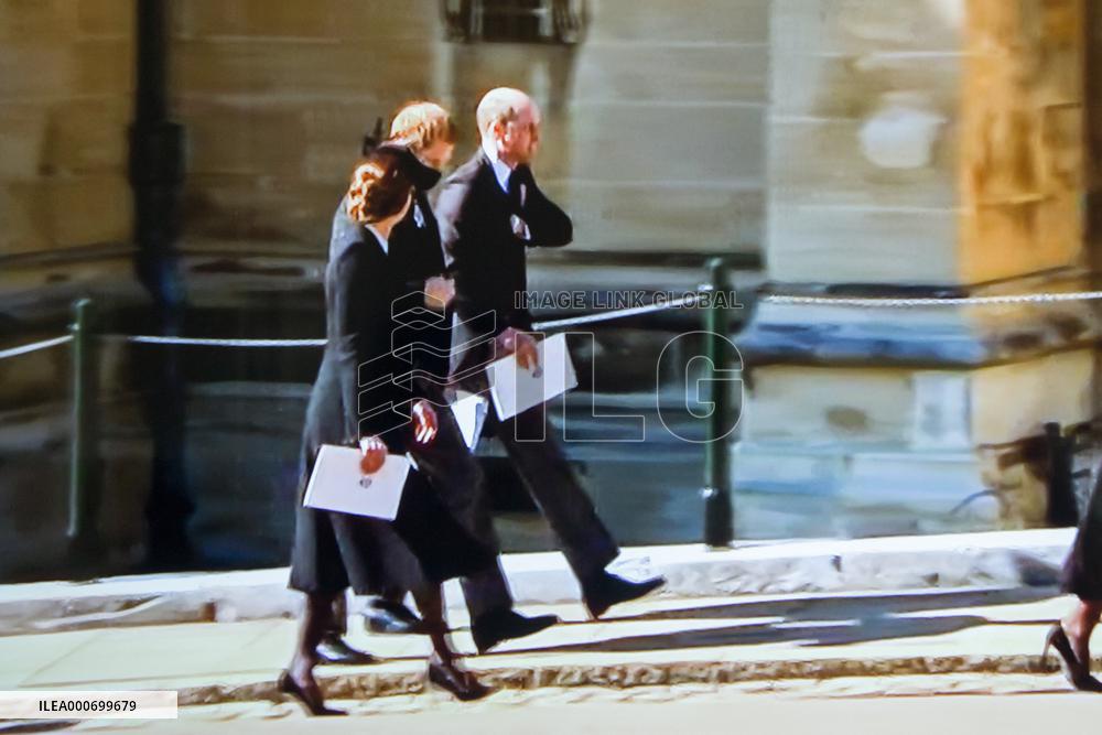 A Family Watching Prince Philip's Funeral On Tv