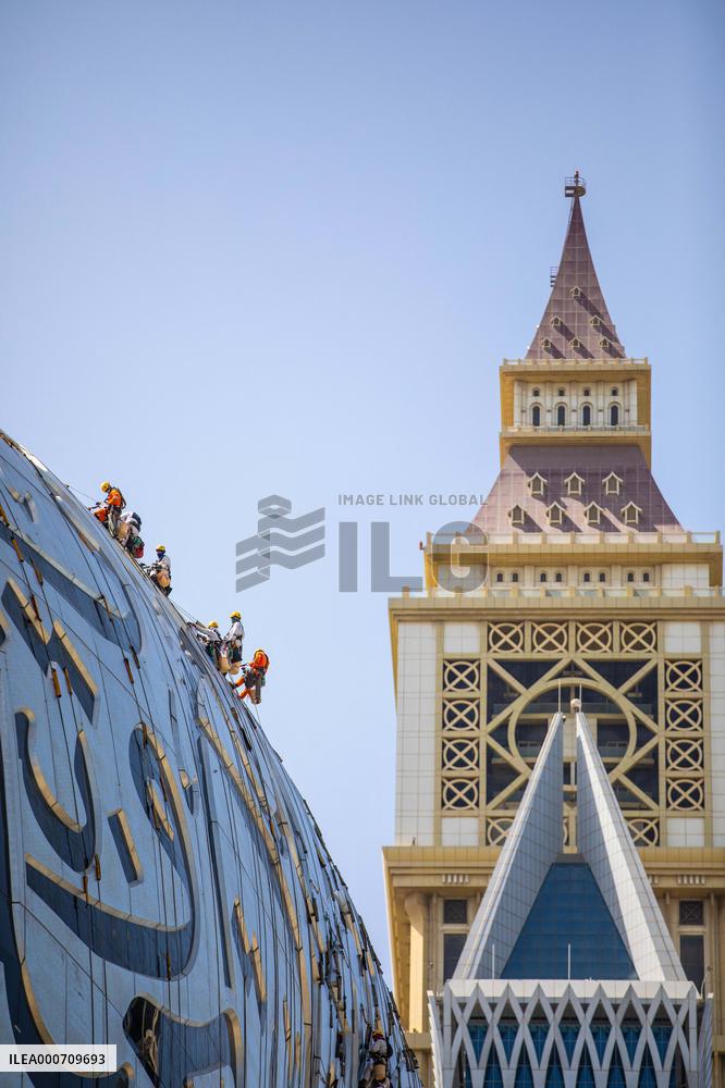 Workers clean the Museum of the Future - Dubai