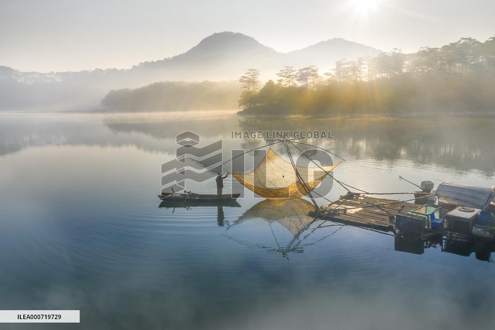 A Man Fishing In Tuyen Lam Lake - Vietnam