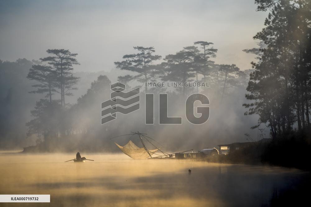 A Man Fishing In Tuyen Lam Lake - Vietnam