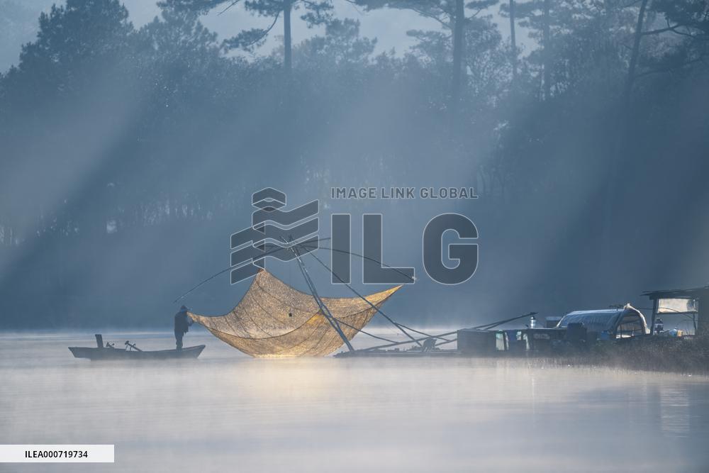 A Man Fishing In Tuyen Lam Lake - Vietnam