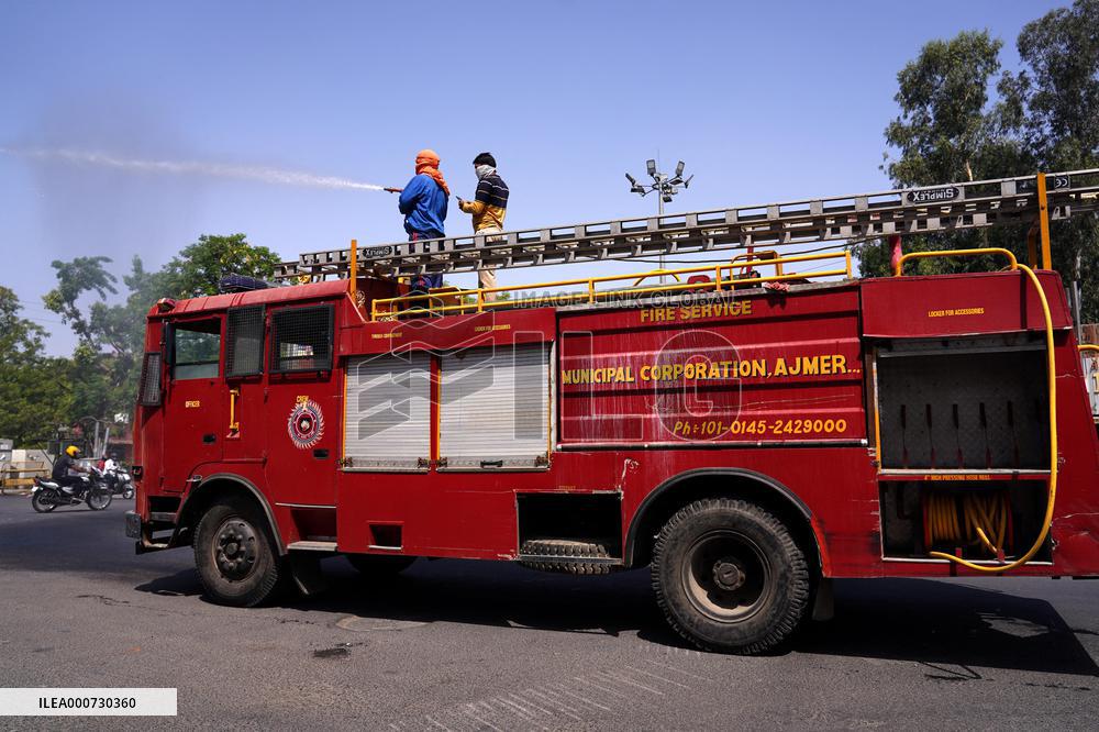 Workers Spray Disinfectant On The Road In Ajmer - India
