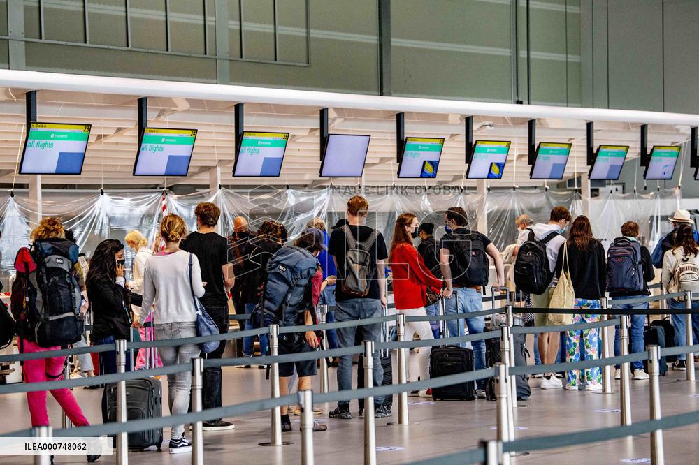 Departure on holiday at Schiphol airport - Amsterdam