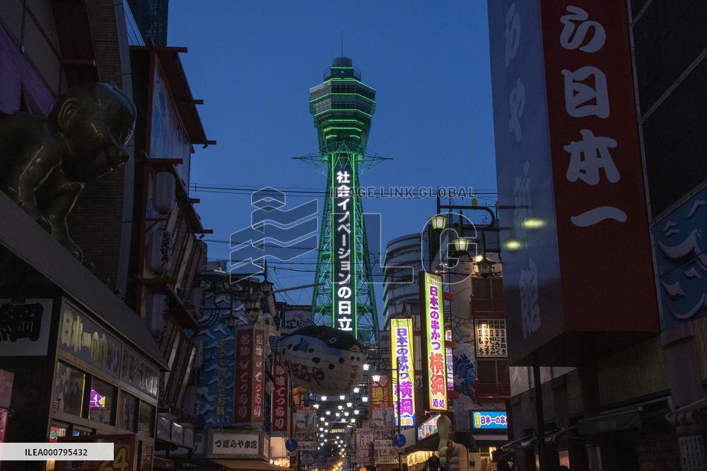 Tsutenkaku Tower lit up in green after achieving the "Osaka Model".