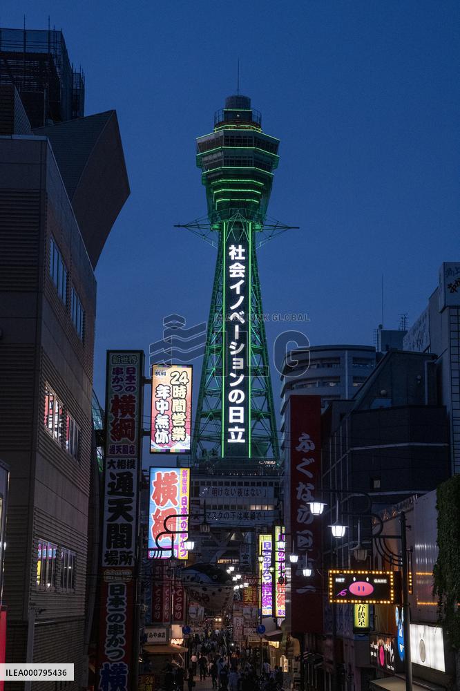 Tsutenkaku Tower lit up in green after achieving the "Osaka Model".