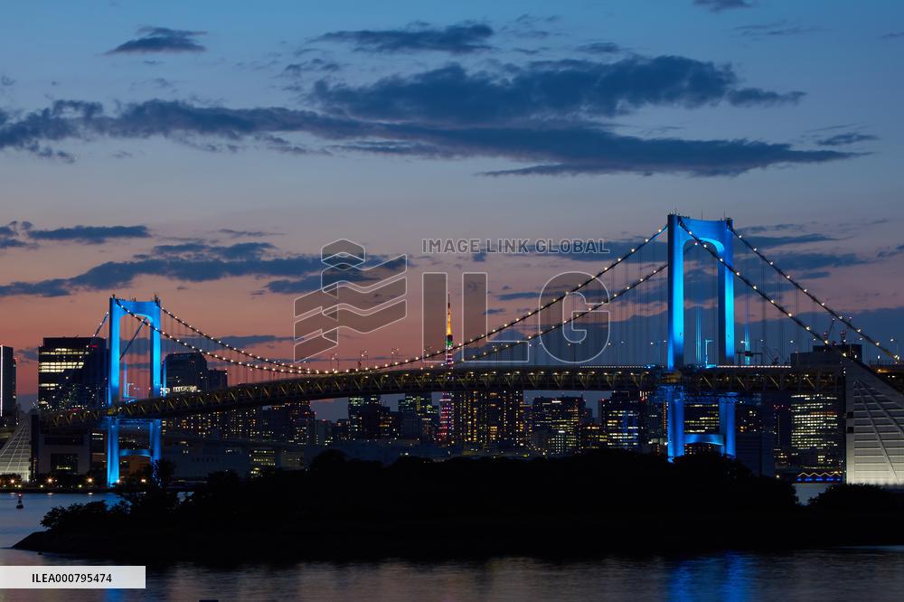Rainbow Bridge lit up in blue