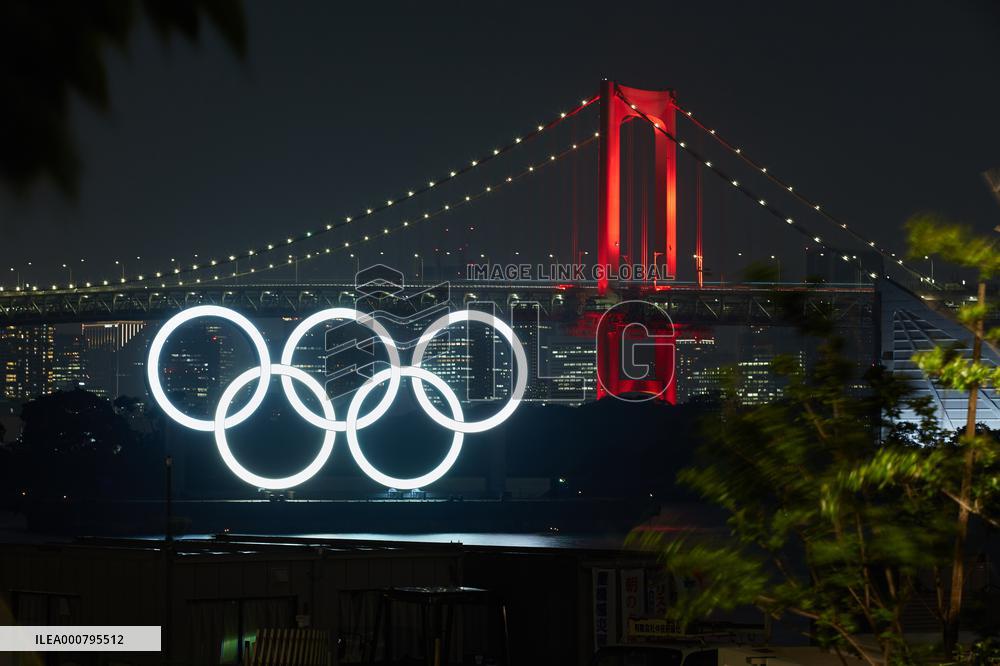 Rainbow Bridge lit up in red