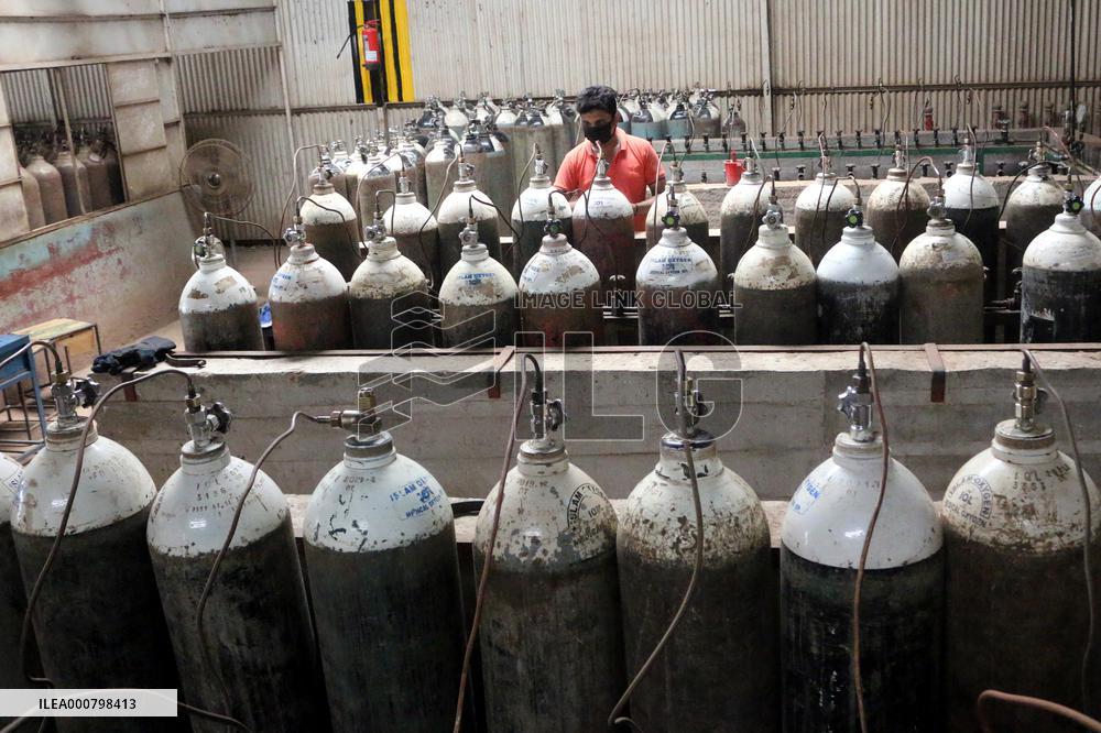 Workers supply oxygen tanks as new Delta variant of Covid-19