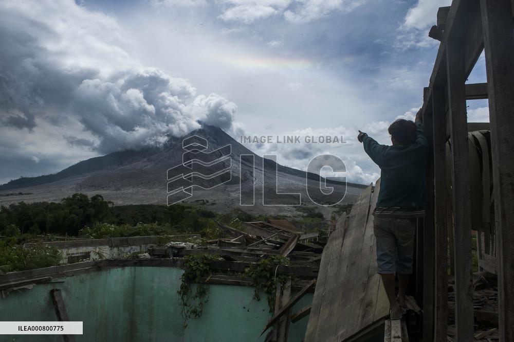 Daily-life Under Shadows Sinabung Eruption - Indonesia
