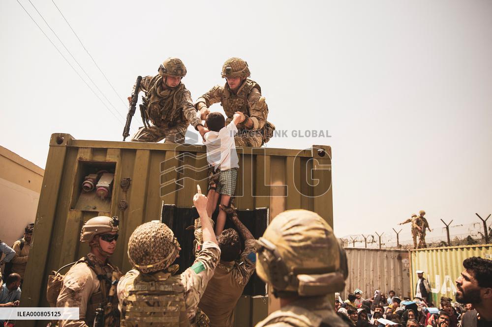 Soldiers with Babies at Hamid Karzai International Airport - Kabul